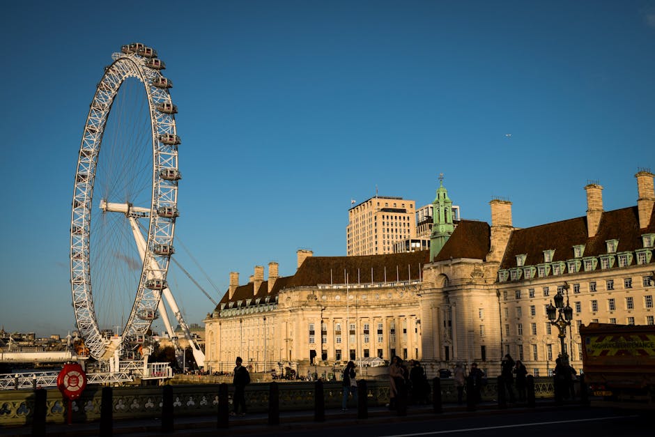 A stunning view of the London Eye and County Hall against a clear evening sky.