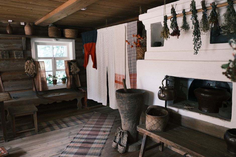 A warm rustic room featuring traditional furniture and decor with a fireplace and wooden accents.